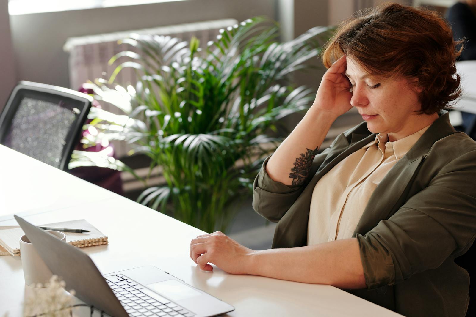 Woman having a headache after an argue with ex-husband