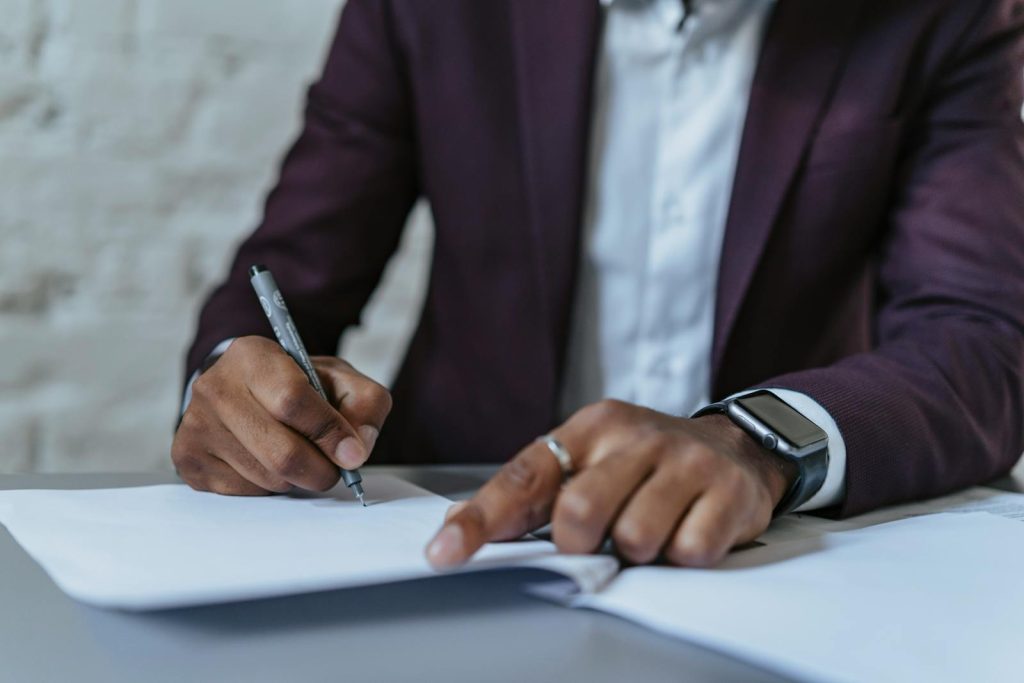 Man signing legal documents