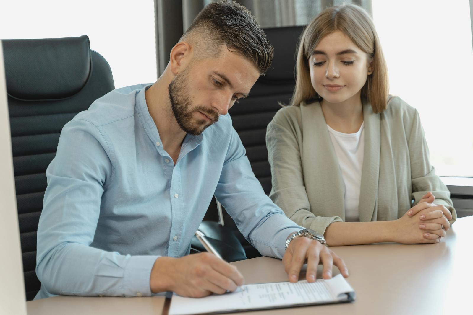 Man signing divorce papers