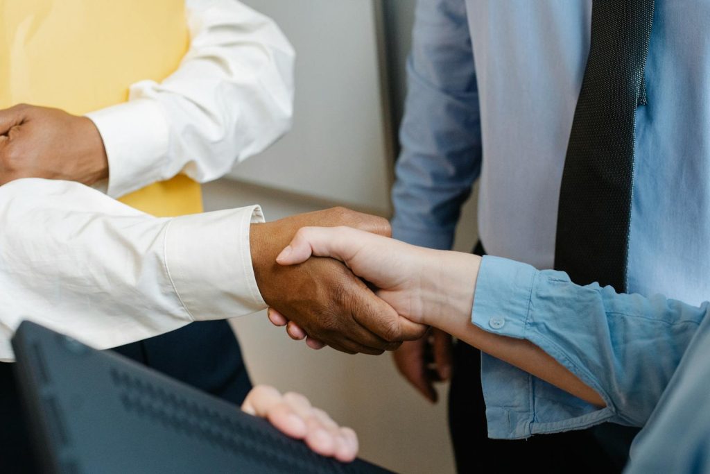 Couple shaking their hands after meeting with mediator