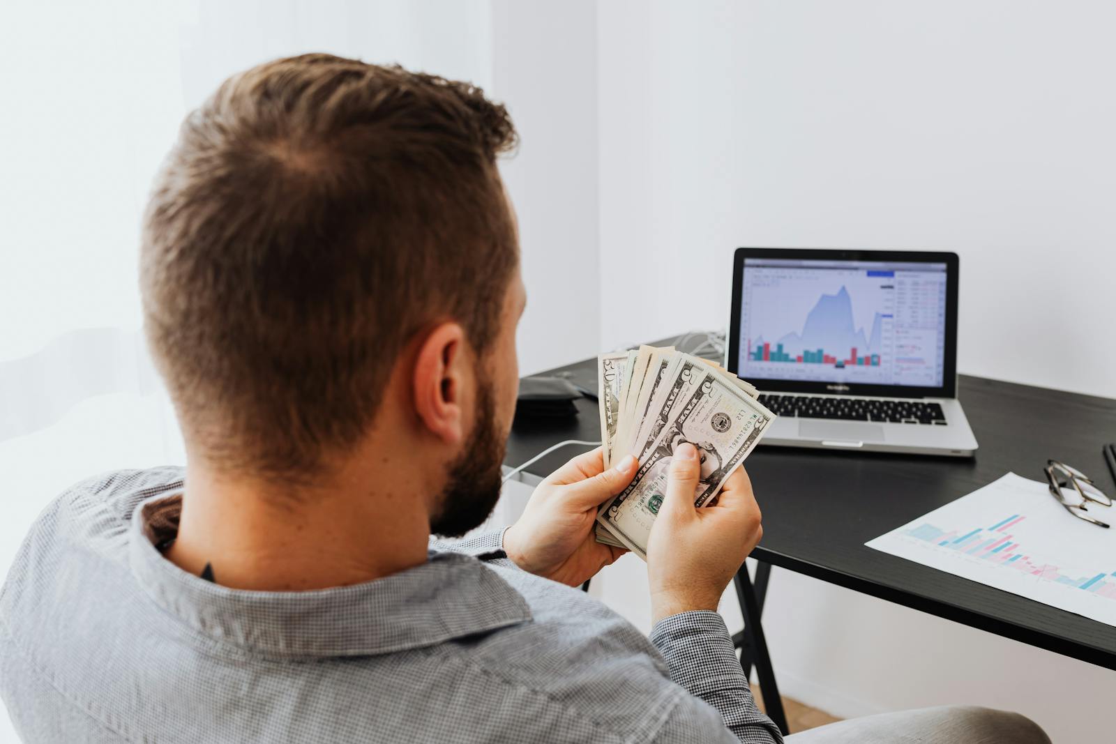 Man preparing money for alimony payment