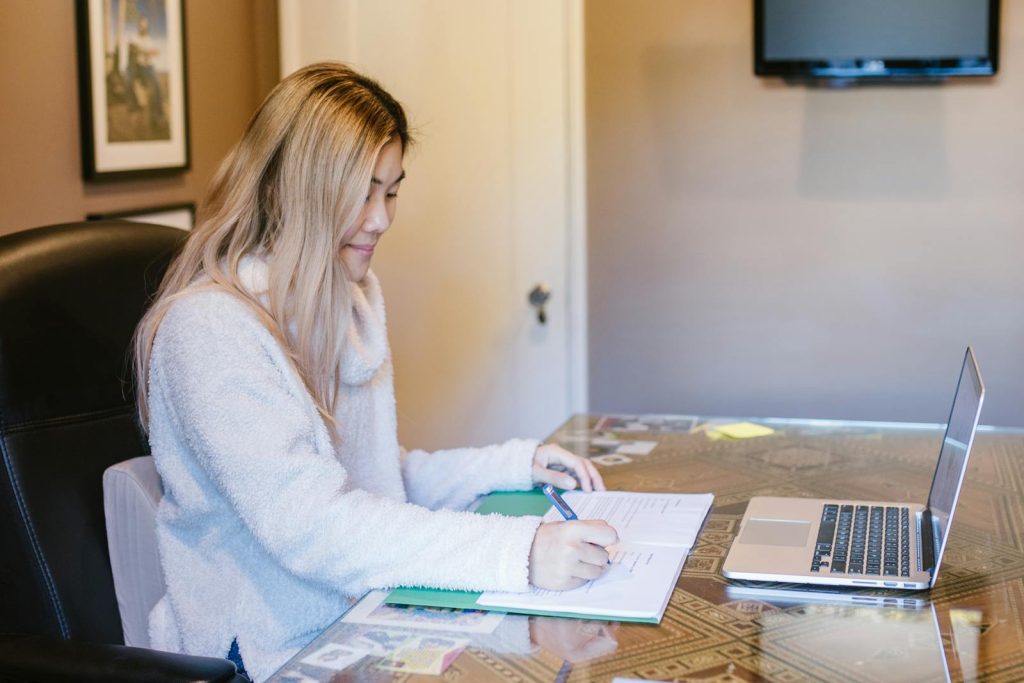 Woman filling documents for alimony