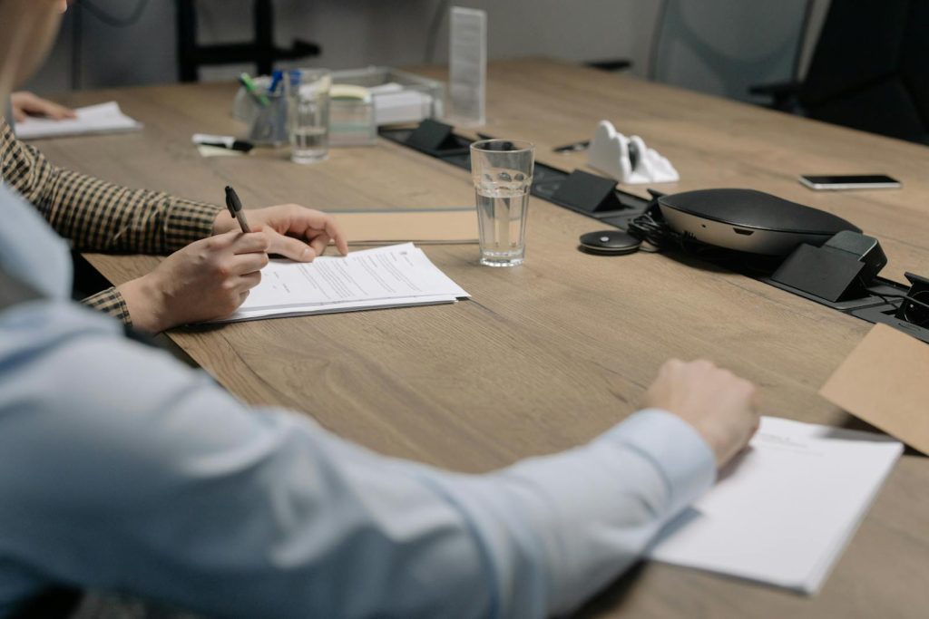 Man signing mediation agreement