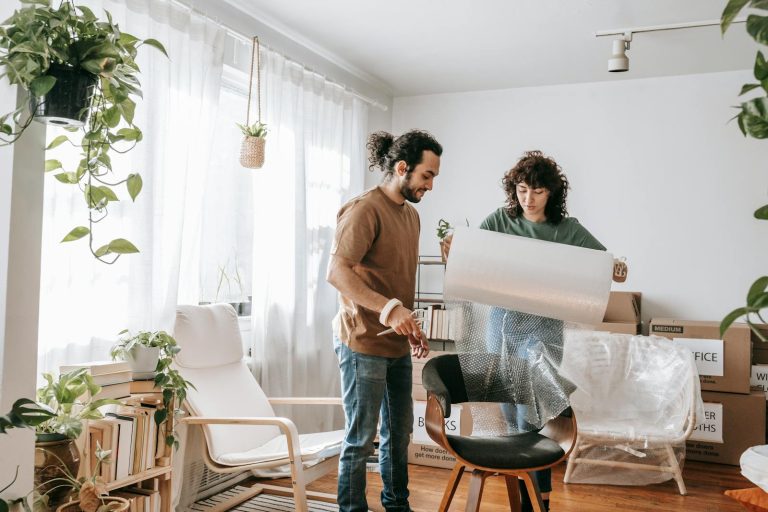 Woman helping her ex-husband pack his things