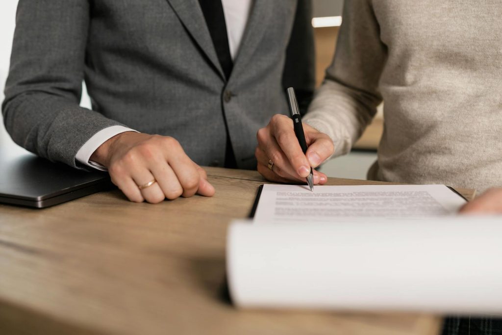 Woman Signing a Divorce Papers