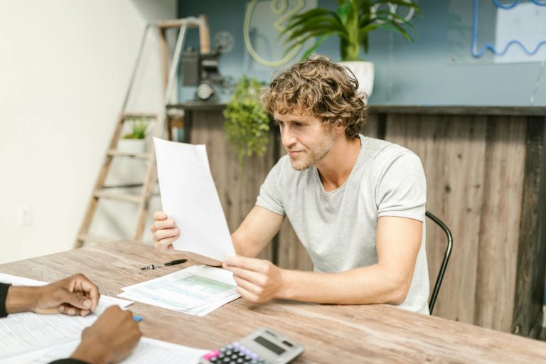 Man reading alimony agreement