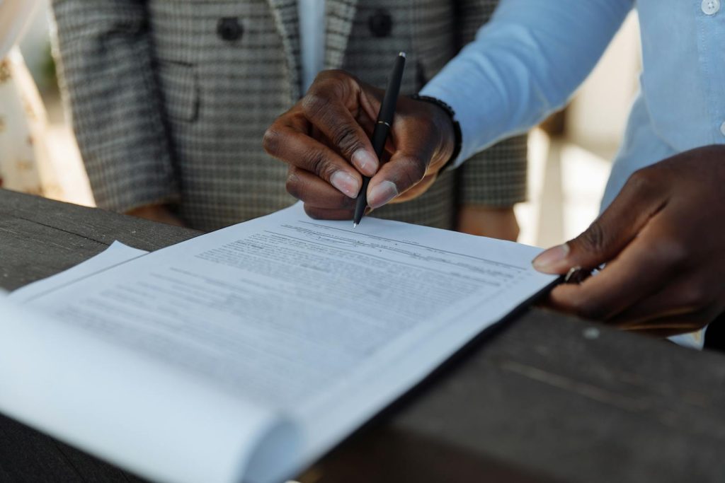 Man signing property division agreement