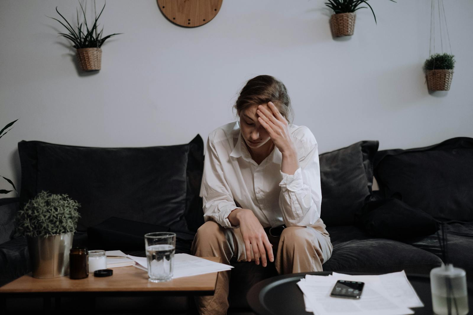 Woman having a headache after a fight with ex-husband